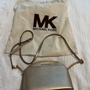 Gold cross body bag.